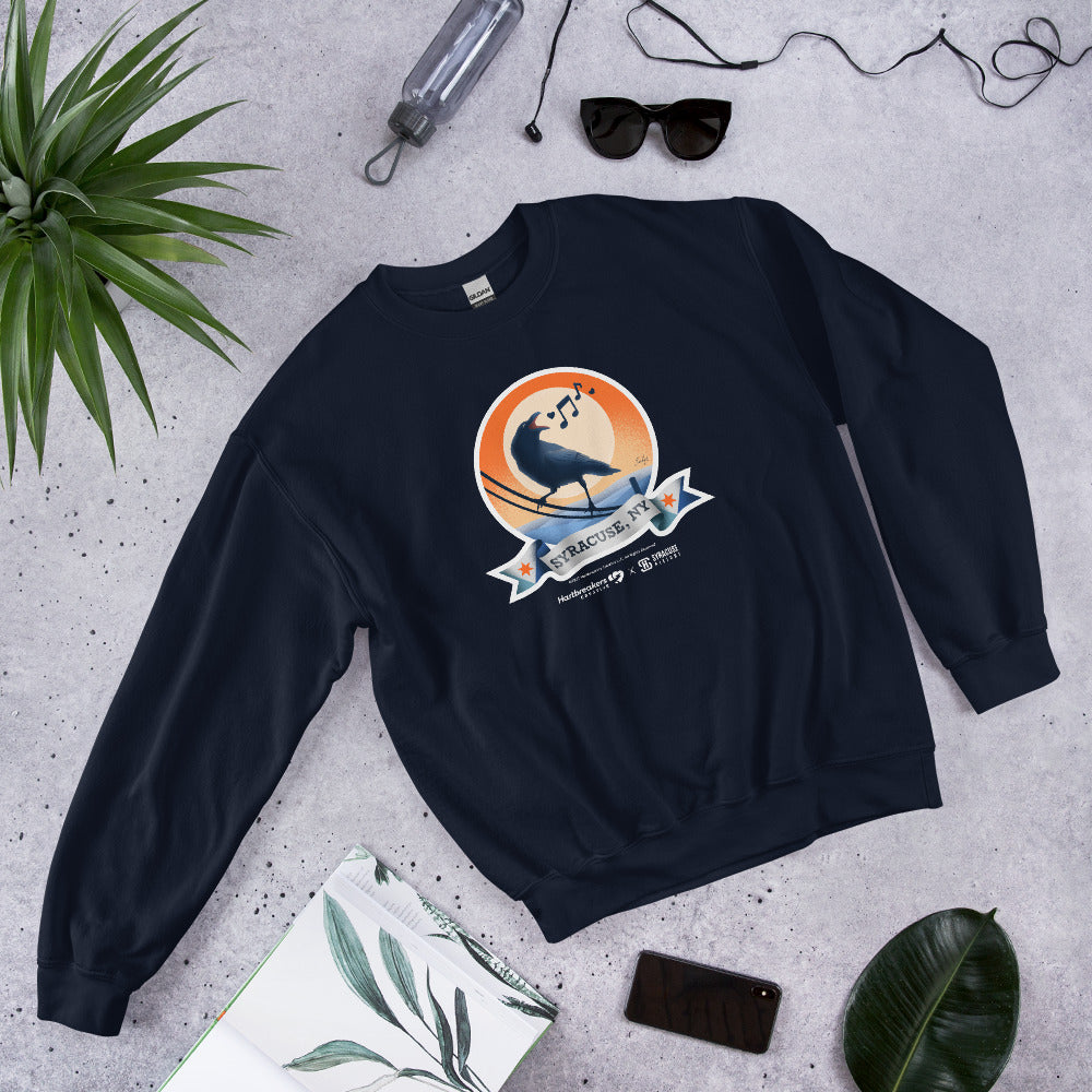 A navy blue sweatshirt featuring an illustration of a crow on a telephone wire and a banner beneath it that says Syracuse, NY